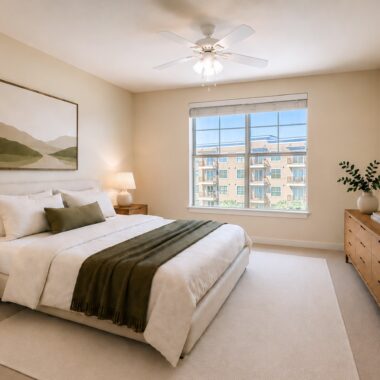 Sunlit bedroom with Bed, Nightstands, and Dresser in Neutral and Green Palette