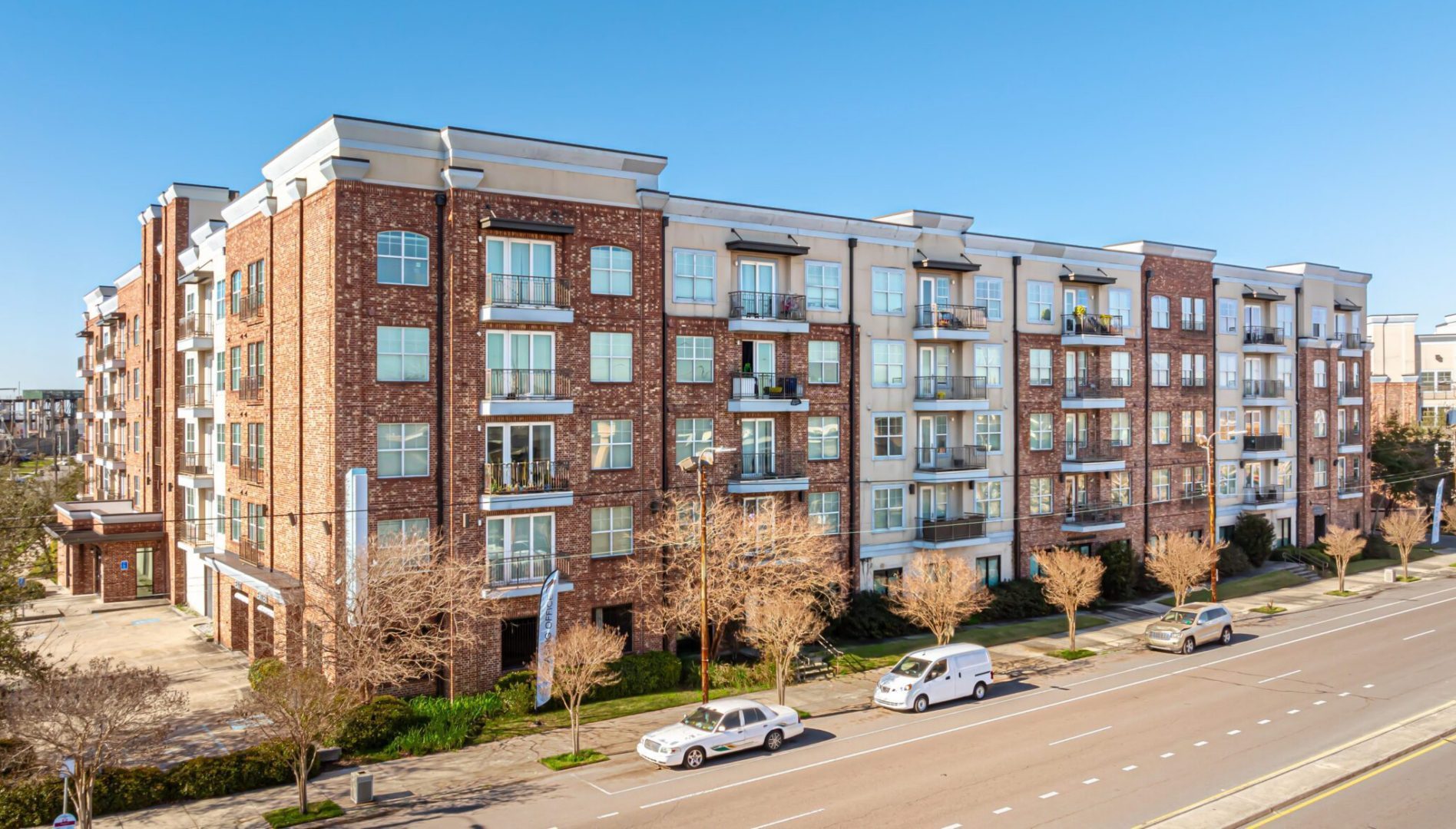 Exterior, tree-lined street view of Crescent Club